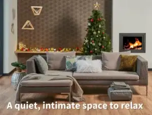 A quiet, intimate space to relax with seasonal smart home automation; minimalist room with grey couch and footstool, fire, christmas tree and decoration